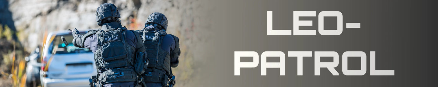 Two police officers in tactical gear on a road with 'LEO-PATROL' text overlay.