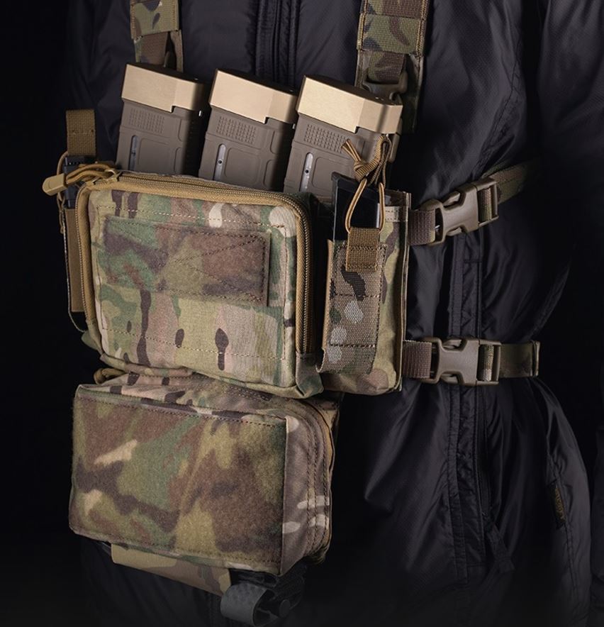 erebus industries MKII Chest Rig multicam pattern, mounted on model, 556 magazines inserted into 5.56 mag pouches, Pistol magazines inserted into pistol pouch, Tourniquet in sleeve on dangler admin pouch