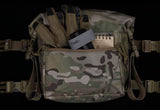 Erebus Industries MKII Expansion Pack Front Item Display in multicam pattern, front pocket zipper open highlighting storage of admin pouch, equipment inserted into pouch gloves, tourniquet, and note pad