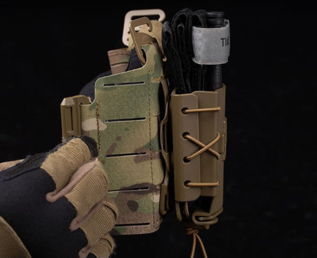 Erebus industries RC series Tourniquet pouch, side view, medical pouches. Mounted to molle mount. tourniquet inserted in pouch. in coyote color. 