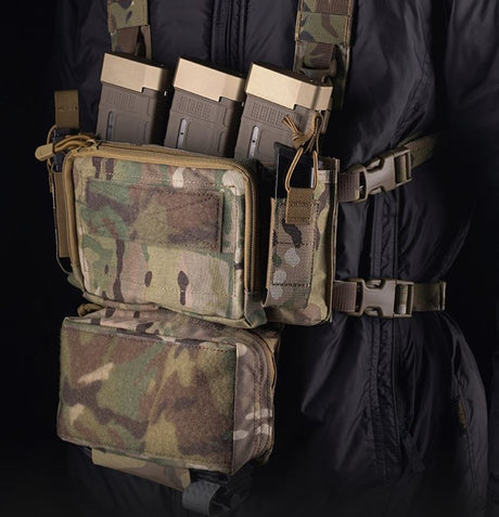 erebus industries MKII Chest Rig multicam pattern, mounted on model, 556 magazines inserted into 5.56 mag pouches, Pistol magazines inserted into pistol pouch, Tourniquet in  sleeve on dangler admin pouch