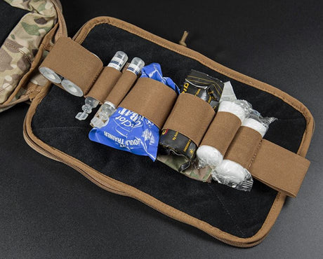 Erebus industries Ifak insert type a, Front view, with medical supplies inserted, mounted on medical pouches. in multicam pattern.